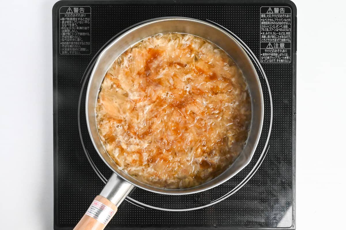 katsuobushi (bonito flakes) in a pan of water to make awase dashi