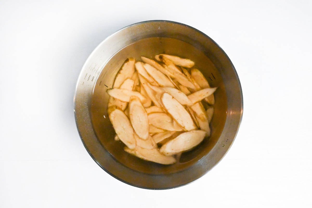 soaking peeled, thin, diagonal slices of burdock root (gobo) in water