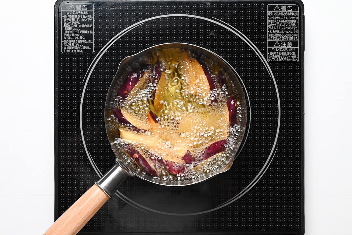 Sweet potato frying in oil