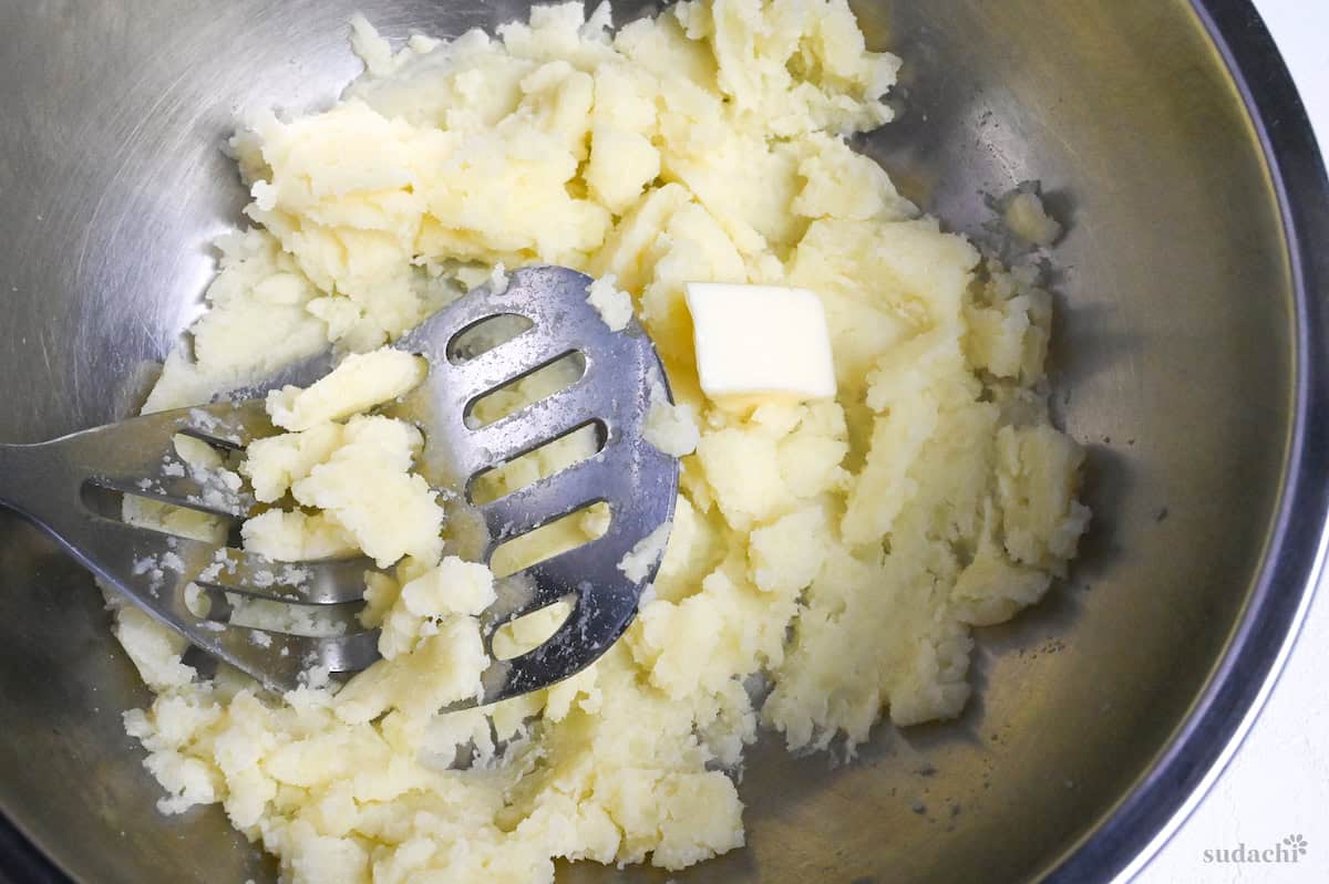 mashed potatoes in a bowl with butter