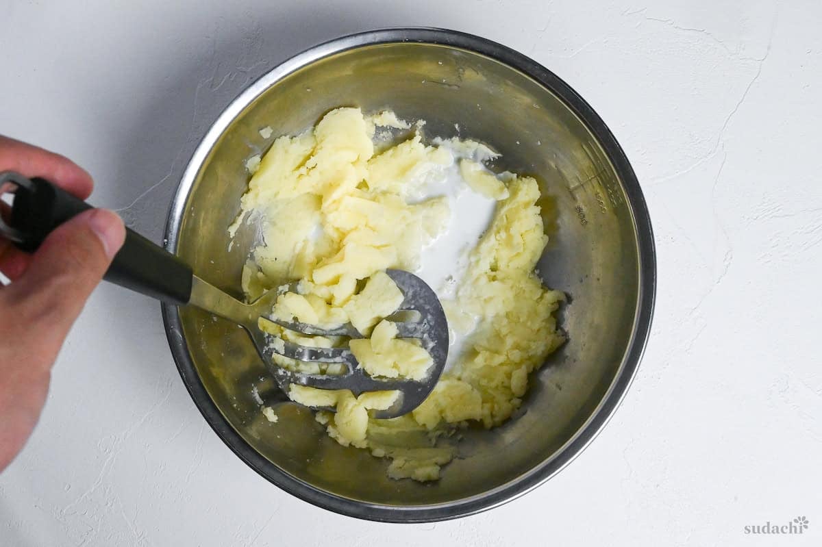 mashed potatoes in a bowl with milk
