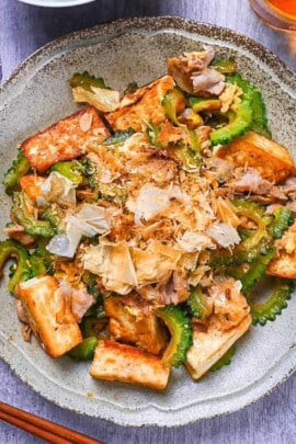 Goya Champuru (Okinawan Bitter Melon Stir Fry) on a grey plate top down view