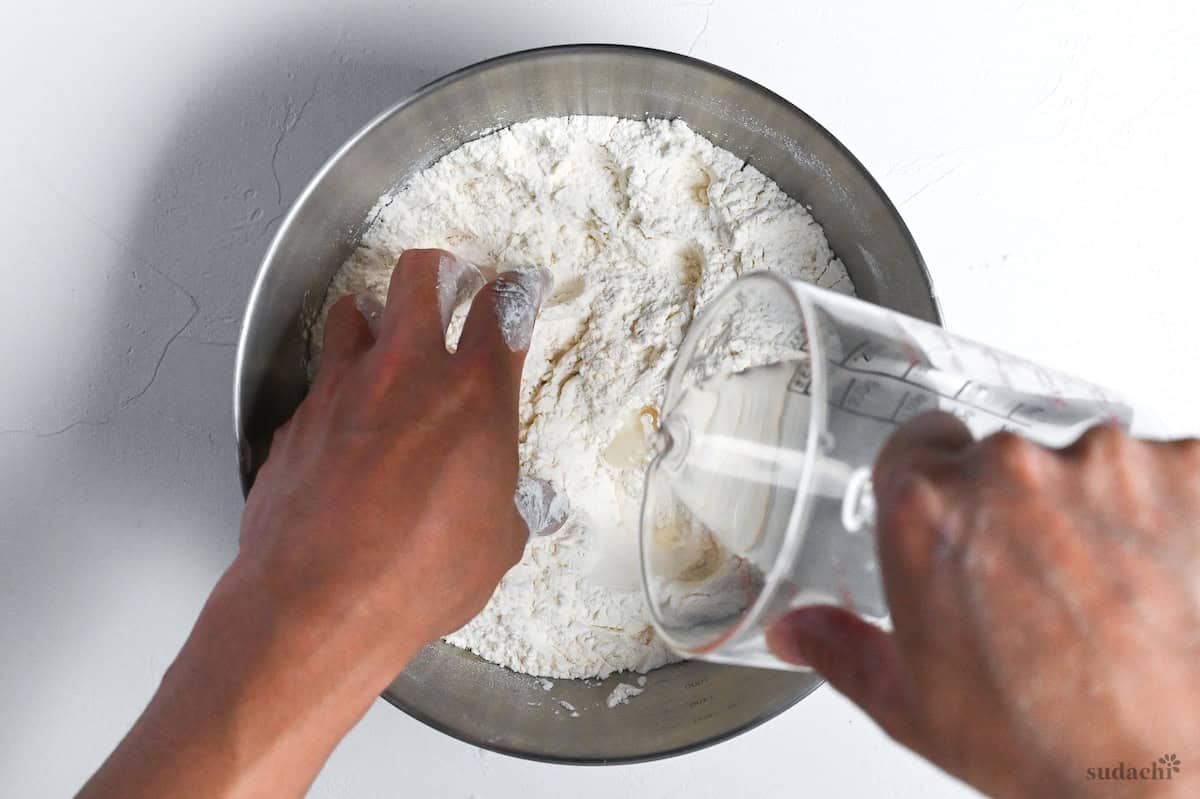 mixing salted lye water into wheat flour to make ramen noodles