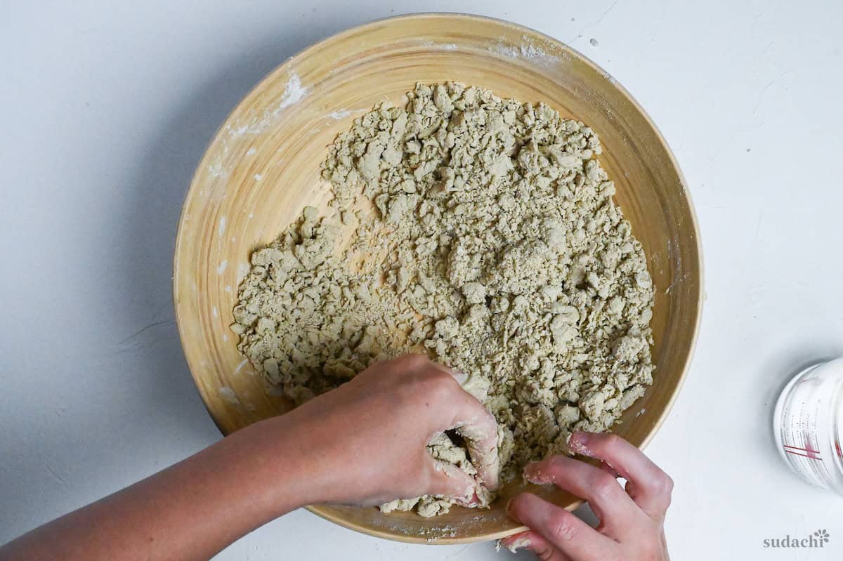moistened crumbs of soba noodle dough in a large bowl