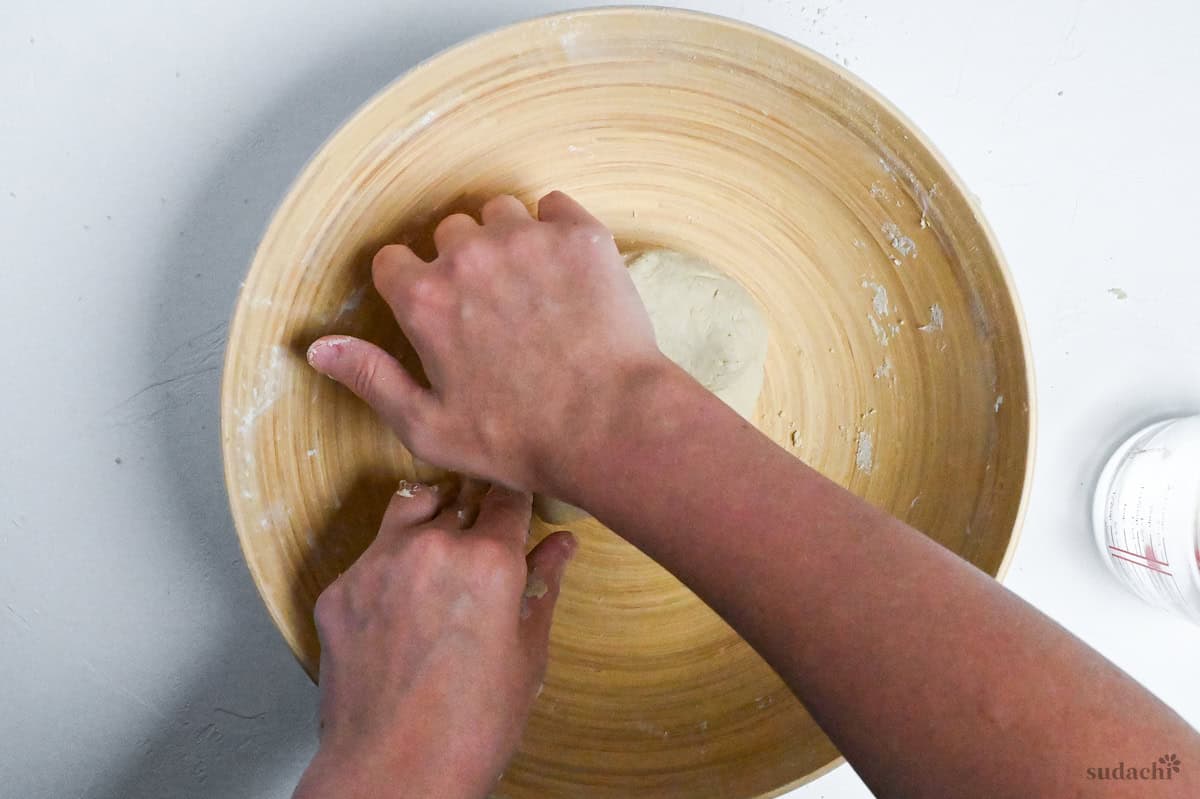 kneading soba noodle dough into a small ball