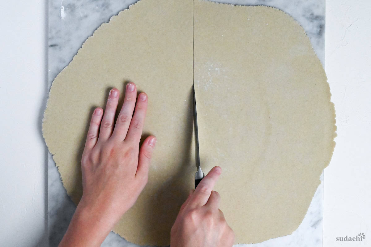 cutting soba noodle dough into manageable pieces