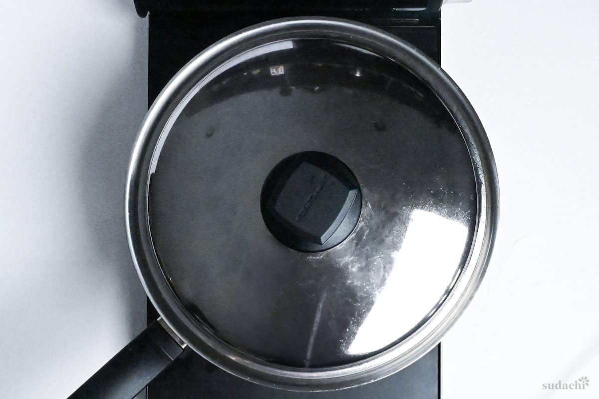 cooking kabocha soup in a pan with lid