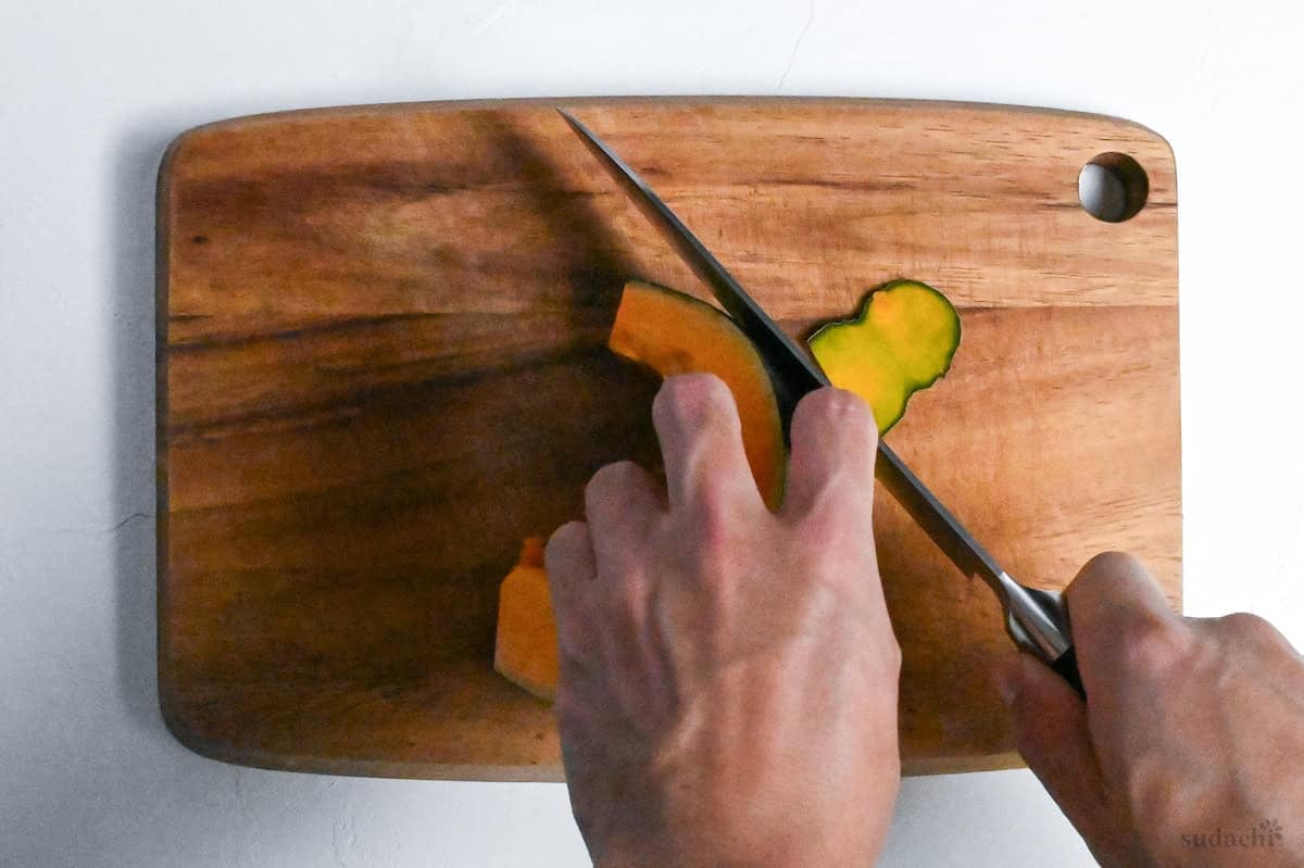 cutting skin of kabocha off with a knife