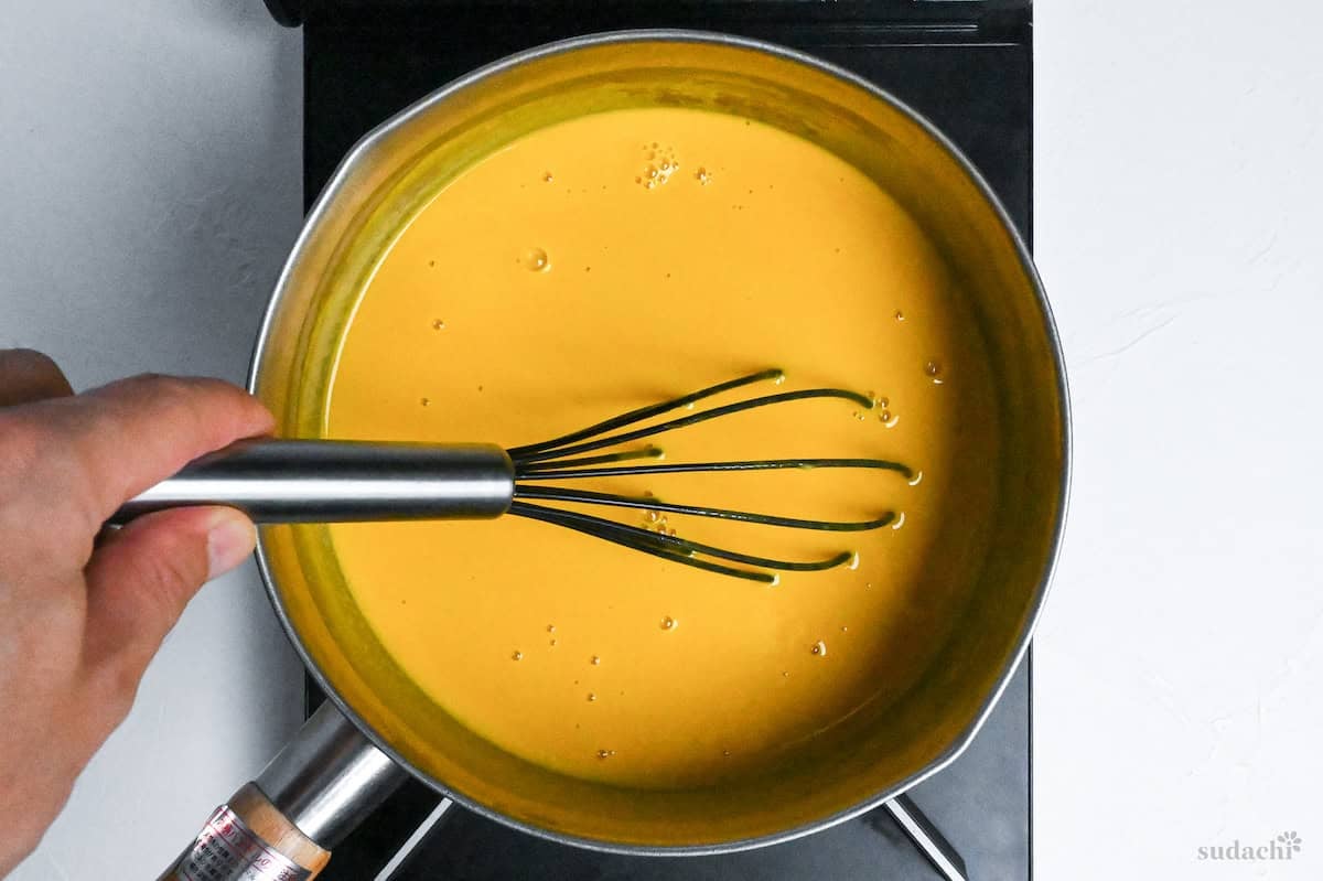 kabocha soup in a pot on the stove top