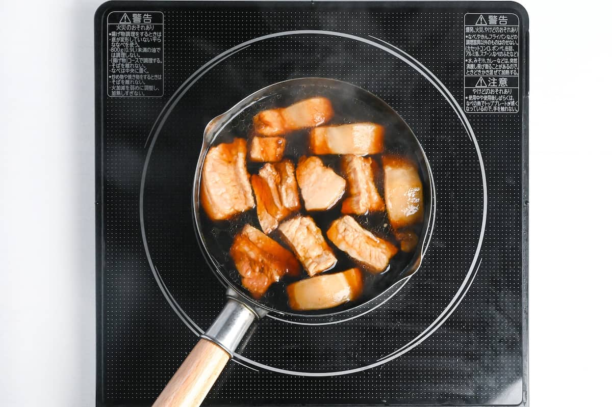 chunks of pork belly simmering in buta no kakuni broth