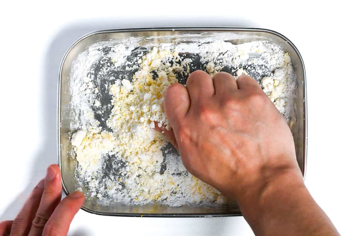 mixing lemon juice, lemon zest and starch by hand to make clumps for "hailstone" effect