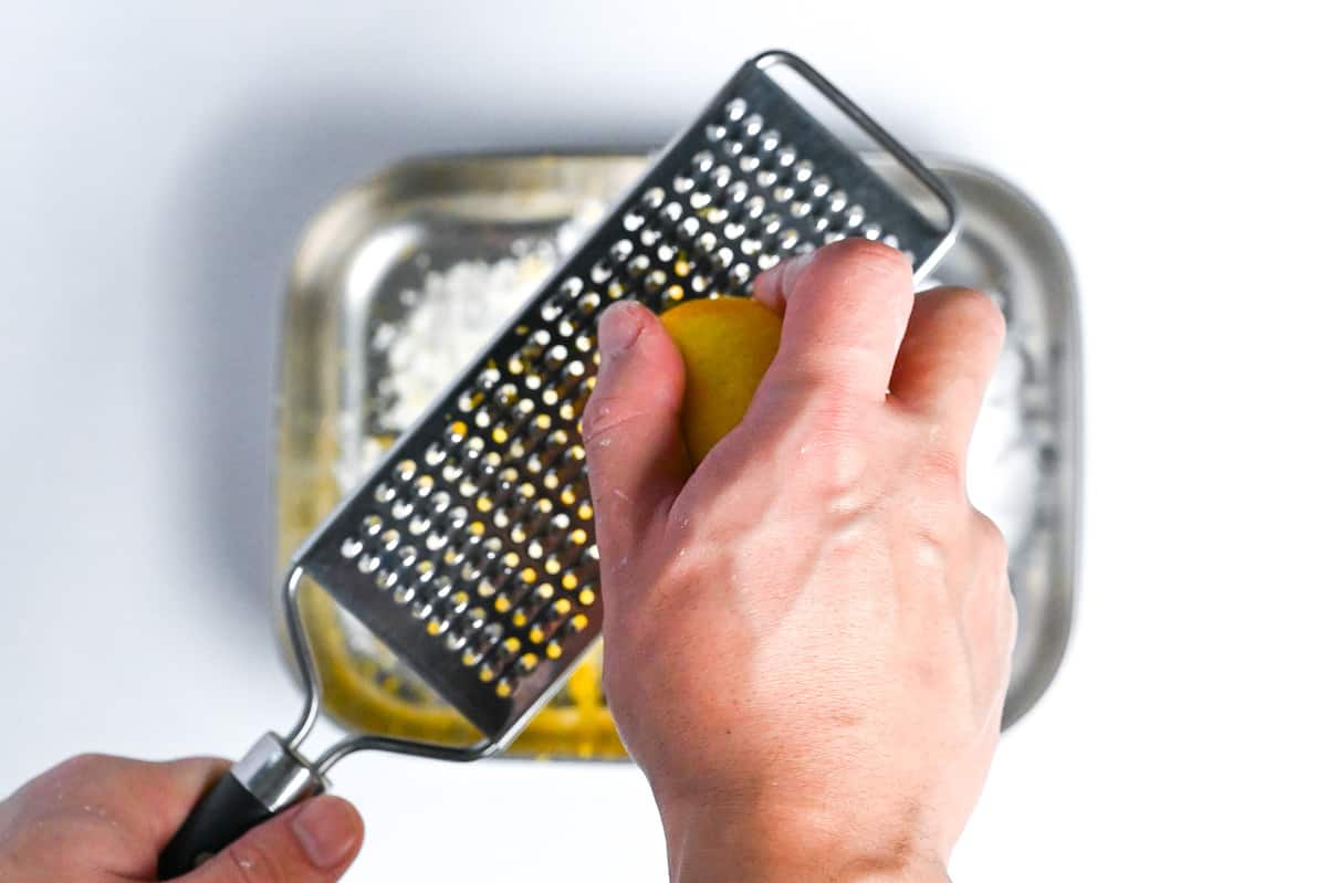 grating lemon peel into starch