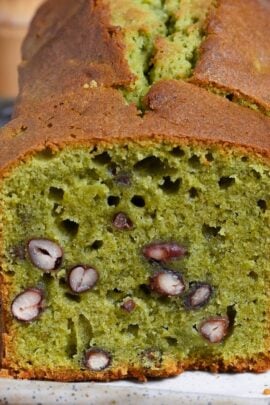 Matcha and adzuki bean poundcake on a cream colored rectangular plate on wooden background