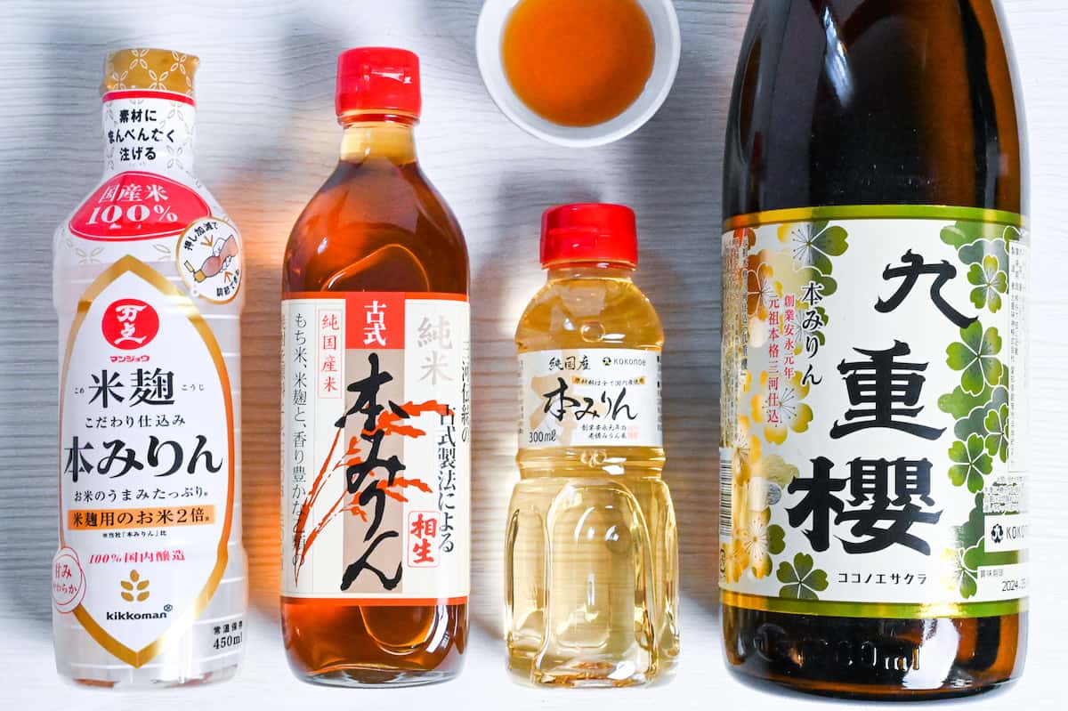 Bottles of Japanese hon mirin (Sweet rice wine seasoning) with some poured in a small white bowl