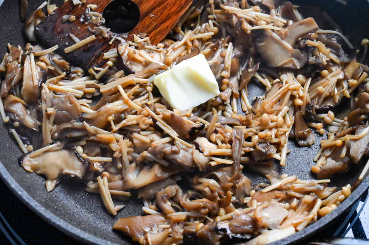 close up of pan-fried mushrooms with butter