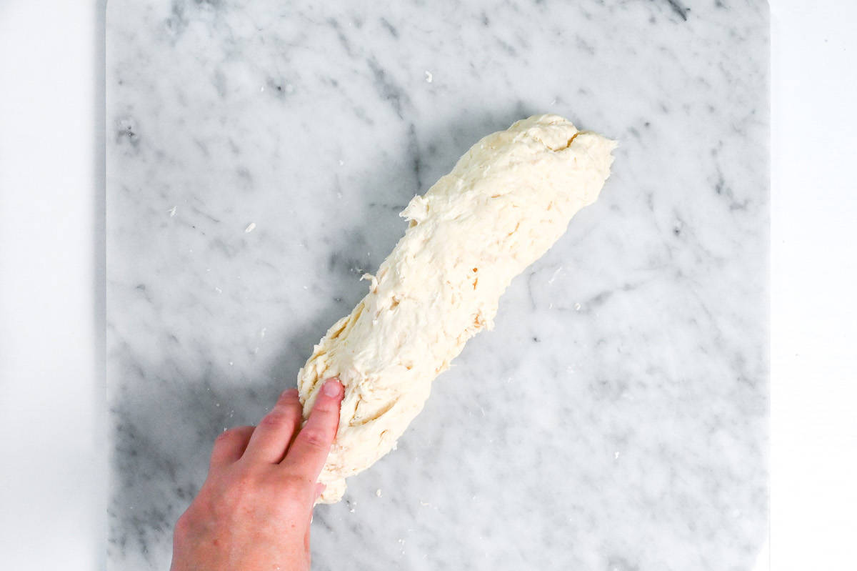 stretching dough using slap and fold technique (French method)