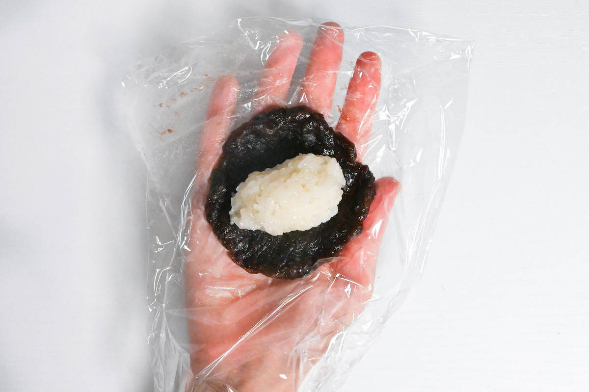 rice in the center of a disk of red bean paste