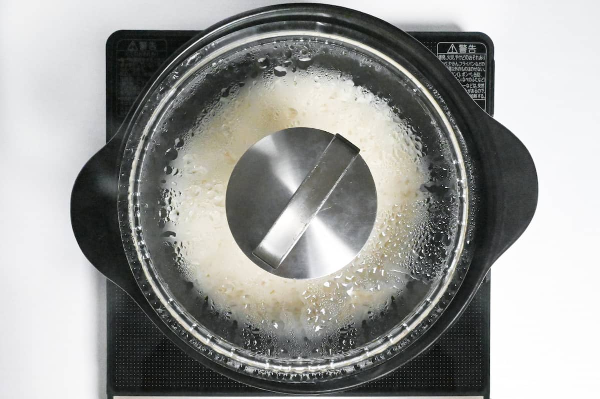 cooked mochi rice steaming in a pot