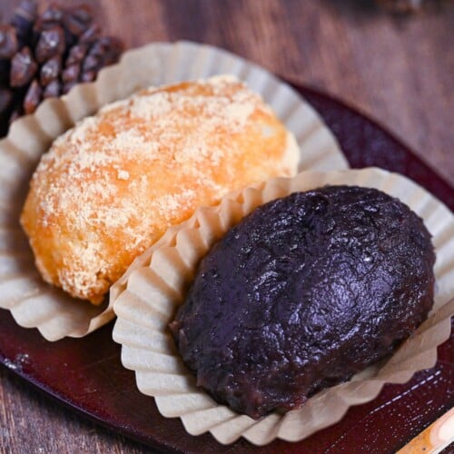 red bean and kinako ohagi on a red leaf-shaped plate