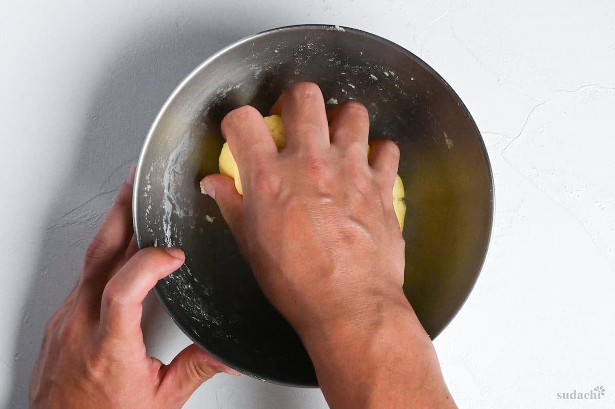 Kneading potato mochi by hand