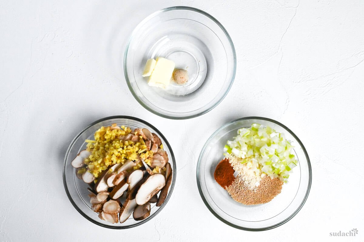 ingredients for salmon fried rice prepared in small glass bowls on a white background