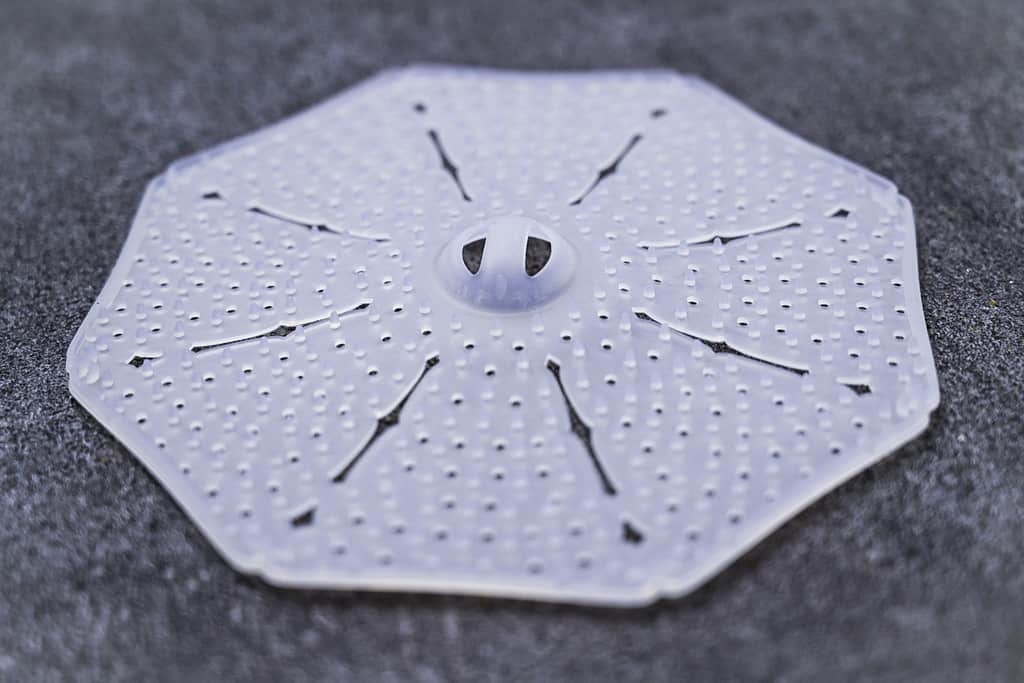 Silicone Japanese drop lid on grey surface