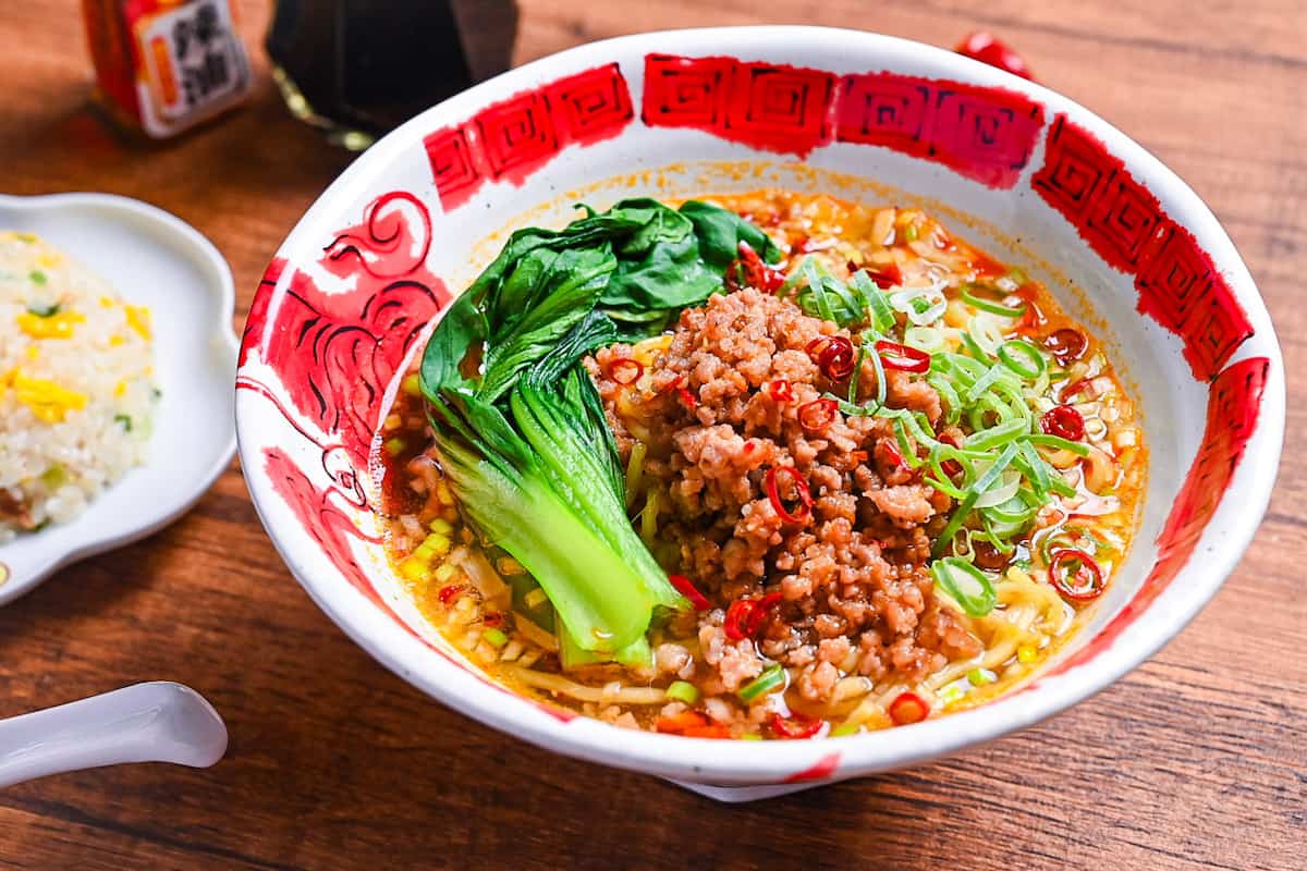 Spicy Japanese style tantanmen ramen in a red and white bowl