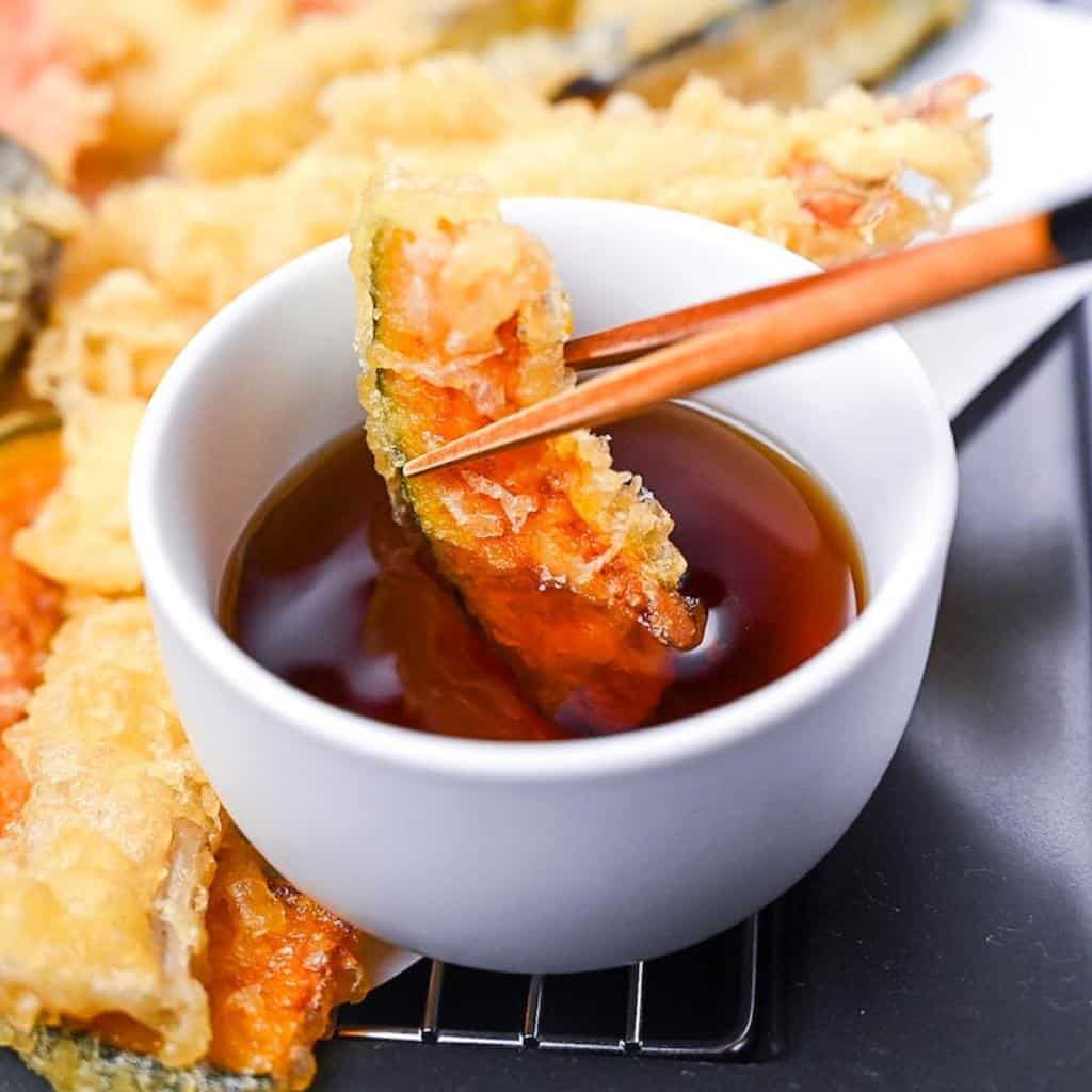 Kabocha tempura dipped in homemade tentsuyu tempura dipping sauce