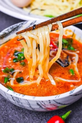 Ramen noodles dipped in a spicy tsukemen soup