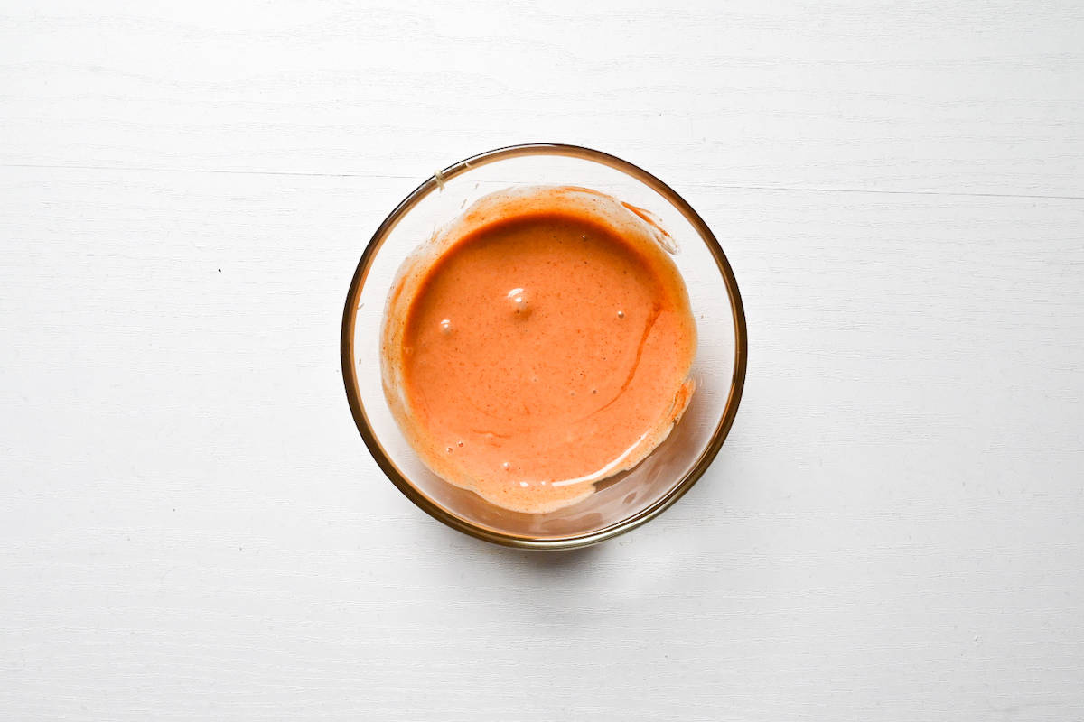 Tsukimi burger sauce mixed in a small glass bowl
