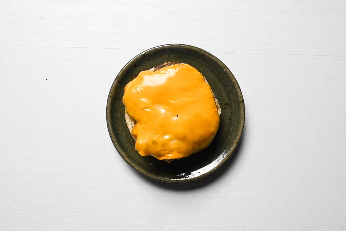 tsukimi burger patty with melted cheese on burger bun base