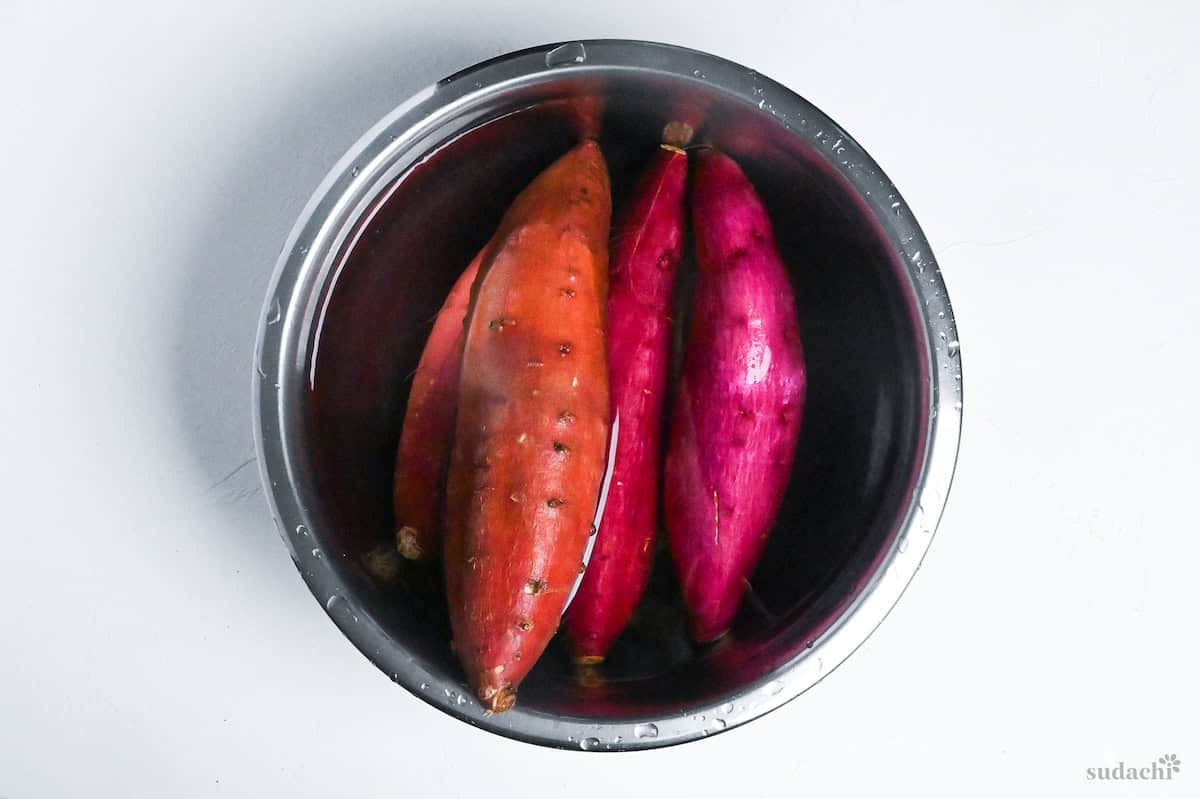 sweet potatoes in a bowl of salted water