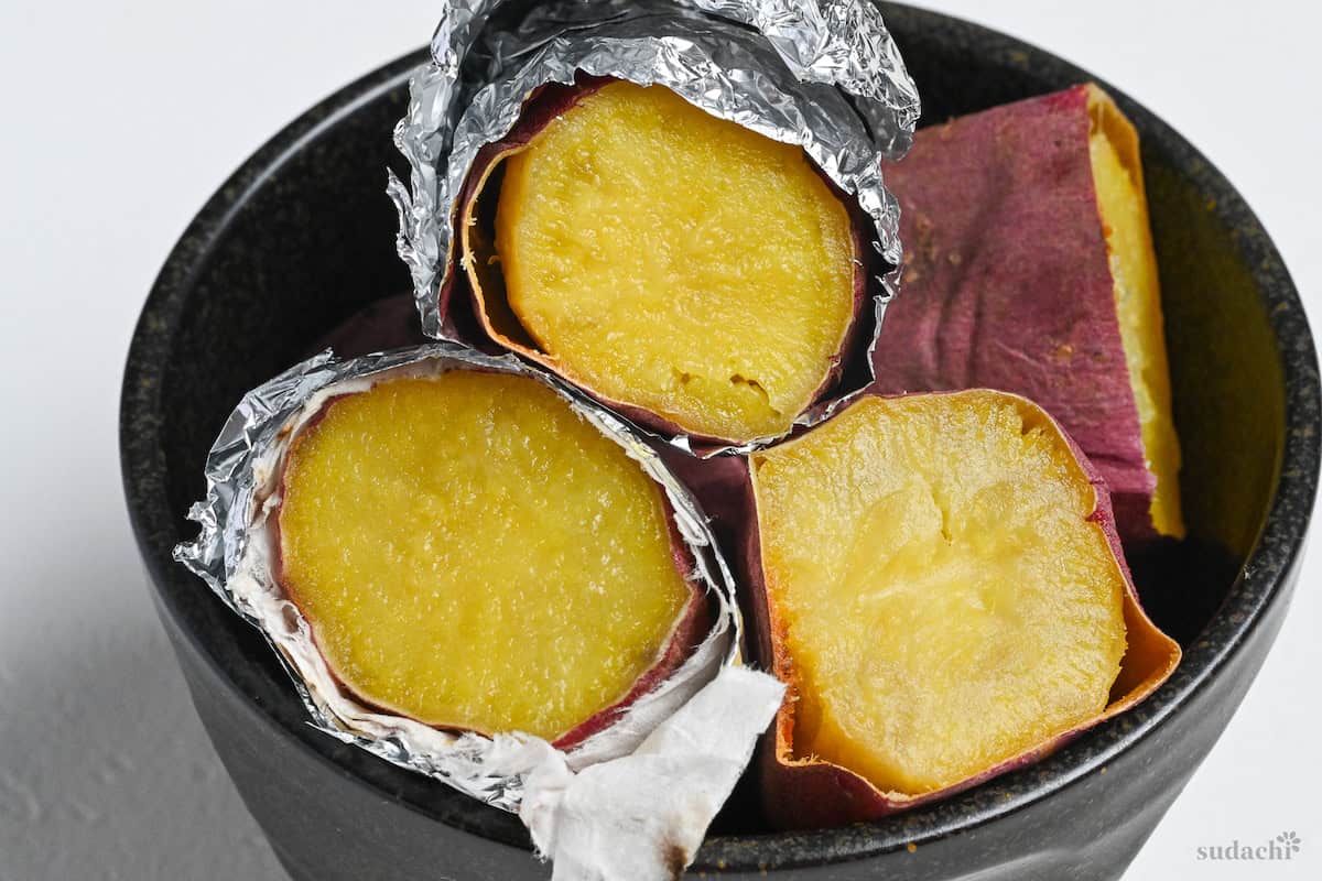 Japanese sweet potatoes (beni haruka) after baking (yaki imo) in a black bowl