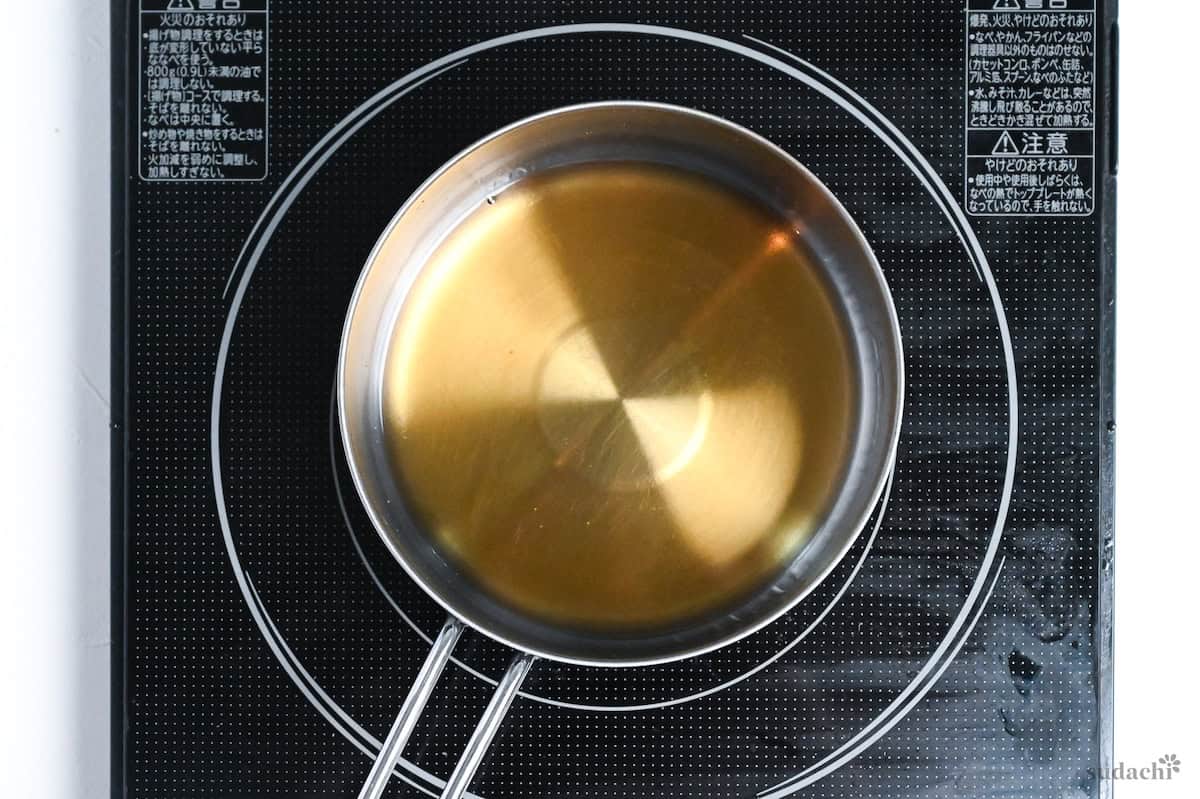 making homemade yakitori sauce in a saucepan on the stove