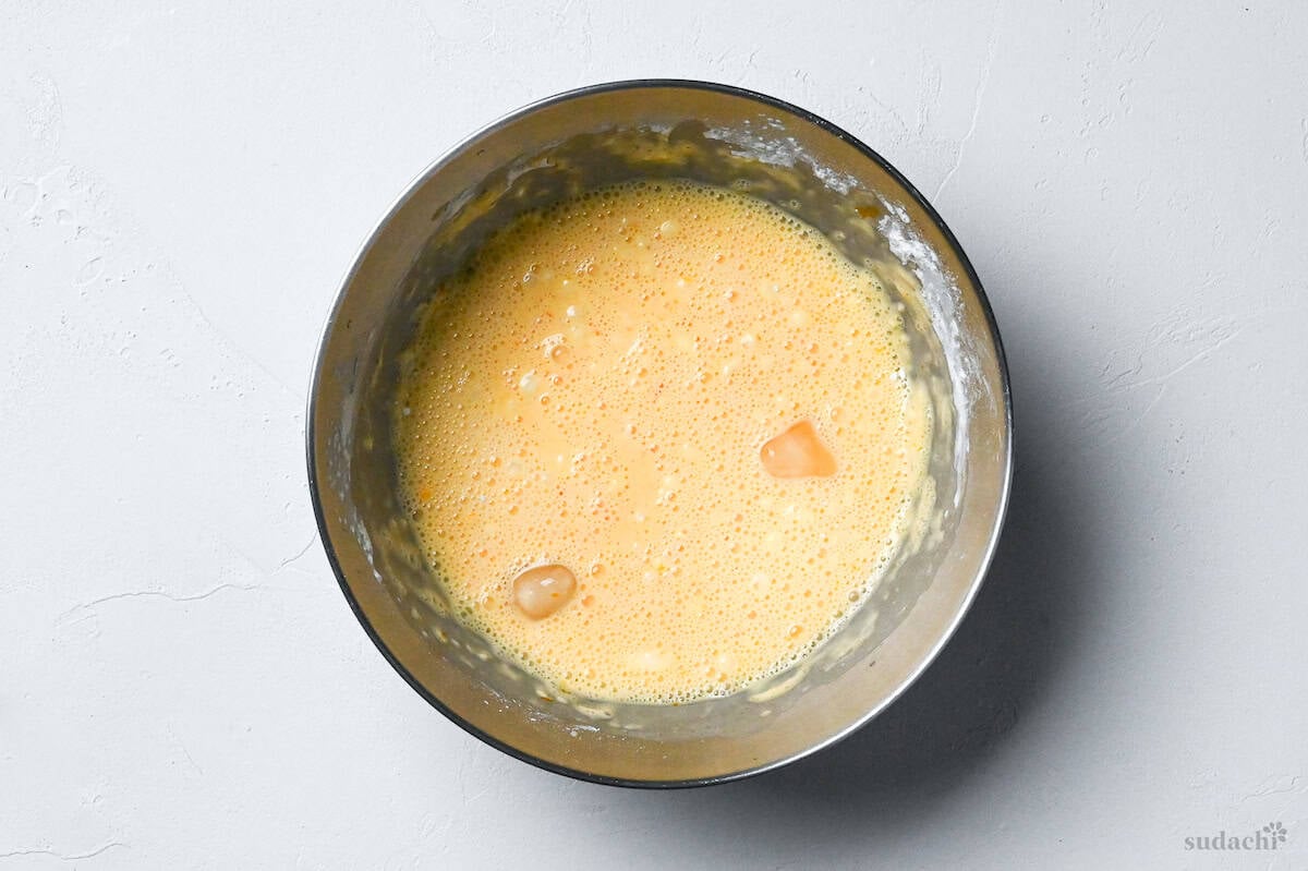 tempura batter in a bowl with ice cubes