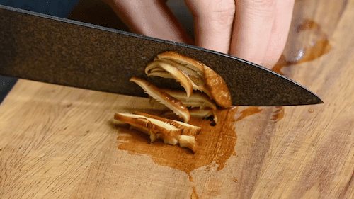 slicing shiitake mushrooms